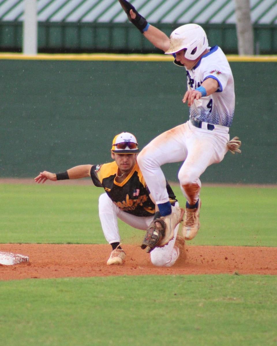 Leesburg's Gabriel Santiago applies the tag to Sanford's Dylan Brazil during Thursday's FCSL game at Historic Sanford Memorial Stadium.