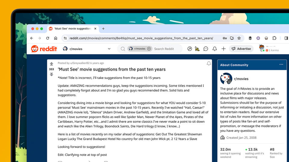 A laptop screen showing a Reddit Movies thread