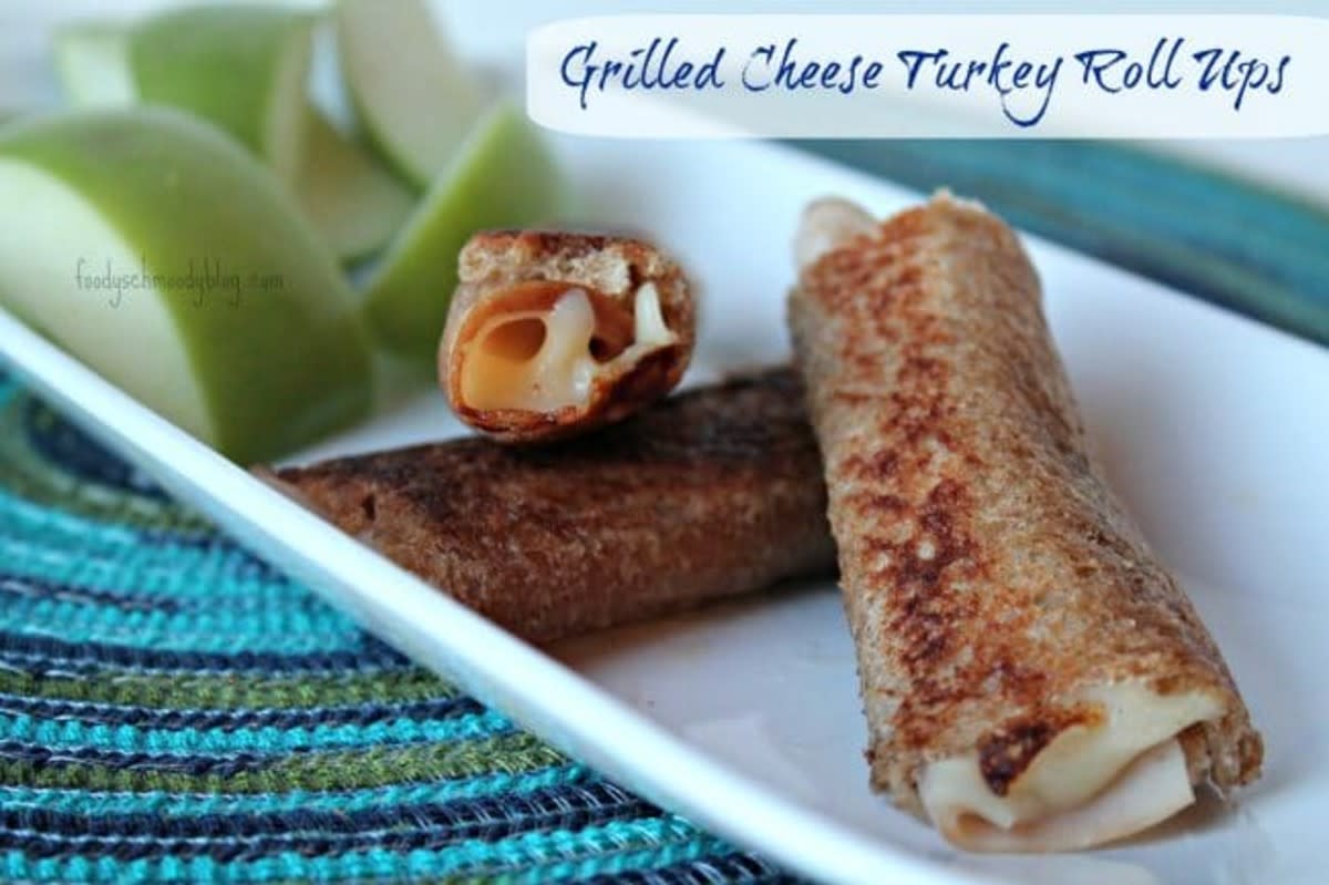 <p>Foody Schmoody Blog</p><p>Serve this version of grilled cheese for lunch, dinner or afternoon snack. This variation adds turkey for a little protein.</p><p><strong>Get the recipe: <a href="https://foodyschmoodyblog.com/grilled-cheese-turkey-roll-ups/" rel="nofollow noopener" target="_blank" data-ylk="slk:Grilled Cheese Roll-Ups;elm:context_link;itc:0;sec:content-canvas" class="link rapid-noclick-resp">Grilled Cheese Roll-Ups</a></strong></p>