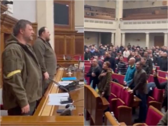 Ukrainian politicians sing the national anthem during a session during the Russian invasion.