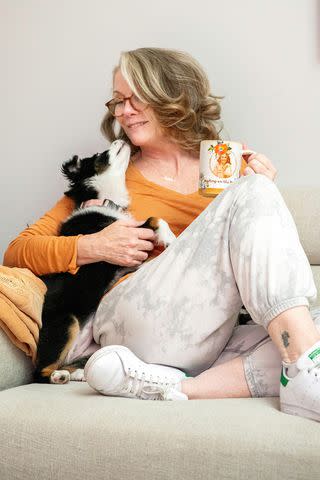 <p>Julie Zahn/Modern Prairie</p> Melissa Gilbert with new pup Sundance and a Modern Prairie mug.