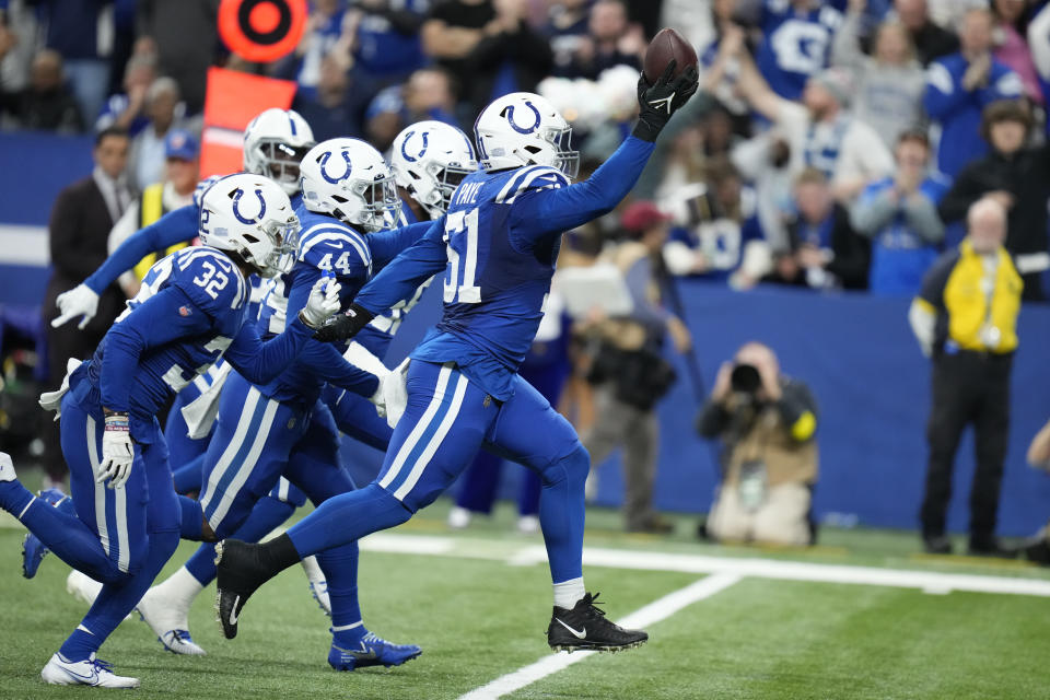 Indianapolis Colts' Kwity Paye (51) celebrates a fumble recovery during the second half of an NFL football game against the Los Angeles Chargers, Monday, Dec. 26, 2022, in Indianapolis. (AP Photo/Michael Conroy)