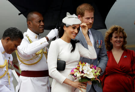 Britain's Prince Harry and Meghan, Duchess of Sussex, arrive in Suva, Fiji, Tuesday, Oct. 23, 2018. Kirsty Wigglesworth/Pool via REUTERS