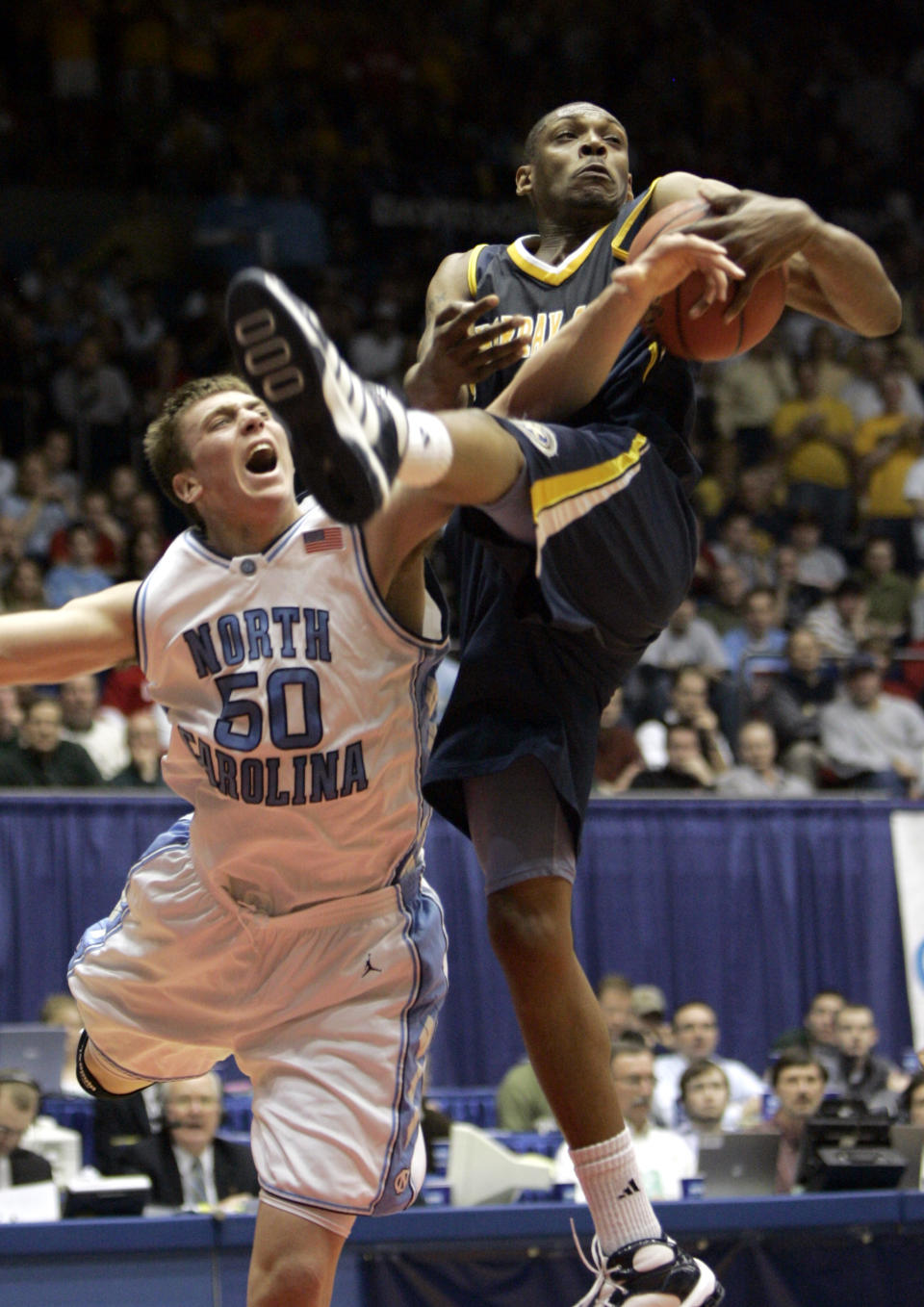 Murray State forward Issian Redding, right, rebounds against North Carolina forward Tyler Hansbrough (50) during the second half of an NCAA men’s basketball tournament first-round game Friday, March 17, 2006, in Dayton, Ohio. (AP Photo/Al Behrman)