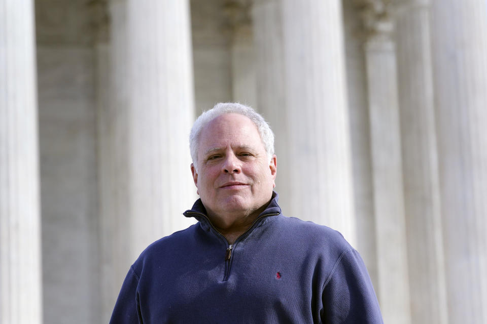 FILE - David Cassirer, the great-grandson of Lilly Cassirer, poses for a photo outside the Supreme Court in Washington, Jan. 18, 2022. Lilly Cassirer surrendered her family's priceless Camille Pissarro painting to the Nazis in exchange for safe passage out of Germany during the Holocaust. The Supreme Court is hearing the case about the stolen artwork now in the collection of a Spanish museum in Madrid. (AP Photo/Susan Walsh, File)