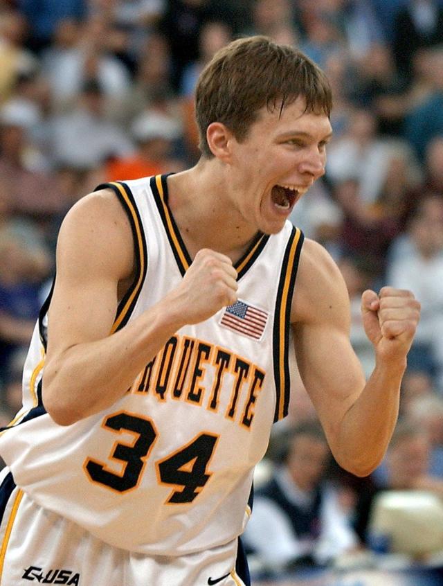 Marquette guard Travis Diener reacts after sinking a free throw that sealed the win for his team over Holy Cross during the 2003 first round of the NCAA Men's Basketball Tournament at the RCA Dome in Indianapolis.