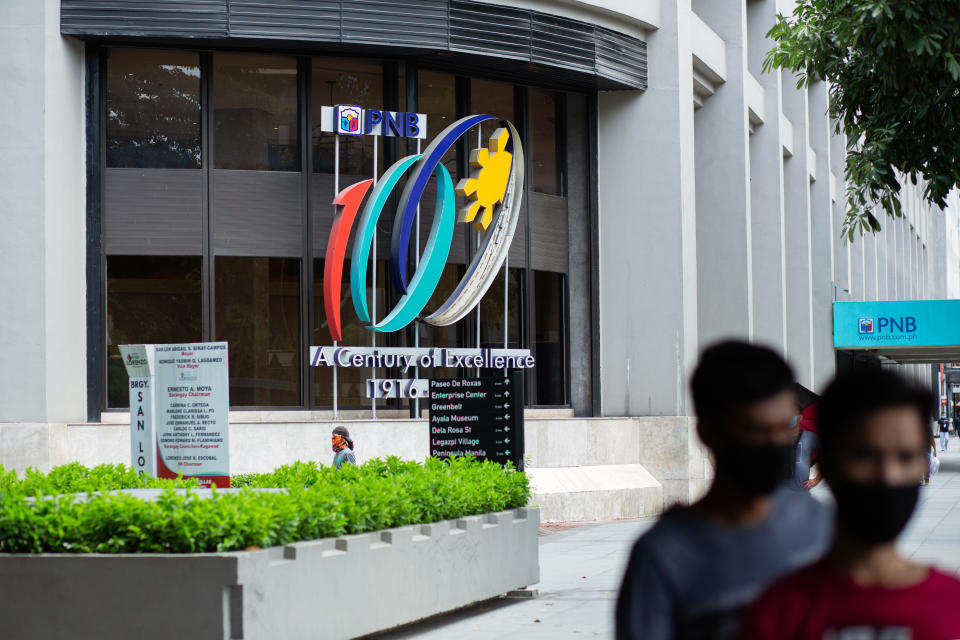 FILE PHOTO: Pedestrians wearing protective mask walk near the Philippine National Bank (PNB) Center in Makati City, Metro Manila, the Philippines, on Monday, July 27, 2020. (Photo: Geric Cruz/Bloomberg)