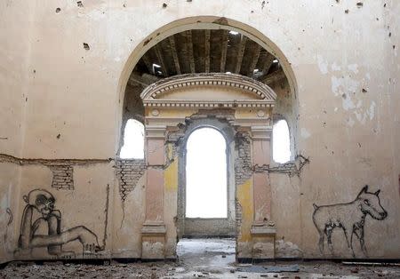 Graffiti is seen on a wall of the Darul Aman palace in Kabul, Afghanistan, June 5, 2016. REUTERS/Omar Sobhani