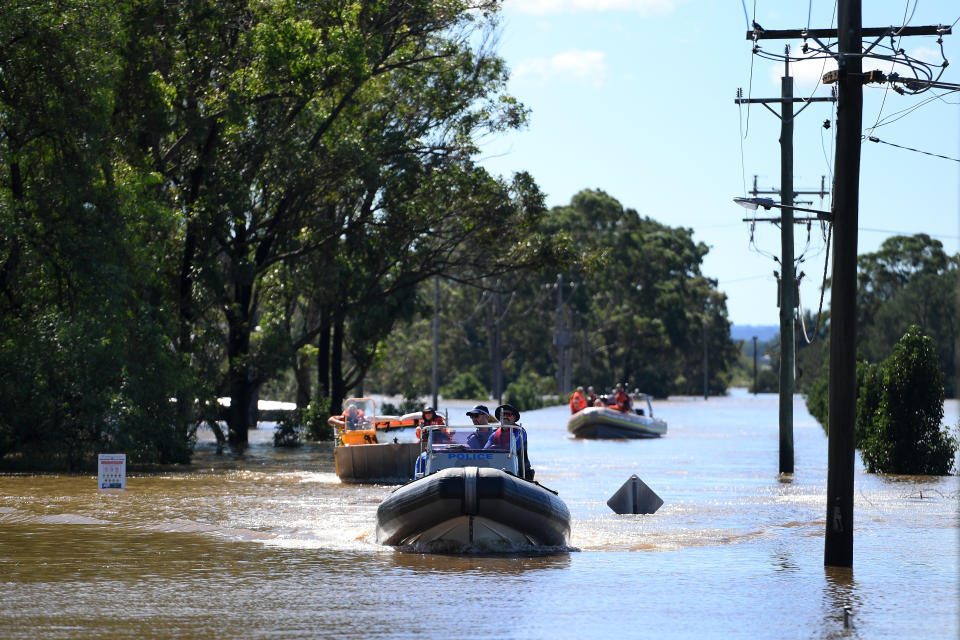 SES volunteers and NSW Police begin delivering food, medicine and essential items and inspecting properties inundated but floodwaters around Windsor in the north west of Sydney. Source: AAP