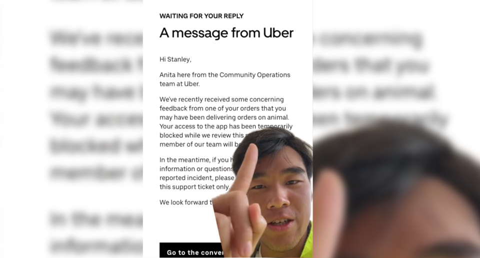 Stanley Chen points to the message he received on the app telling him he was banned. 