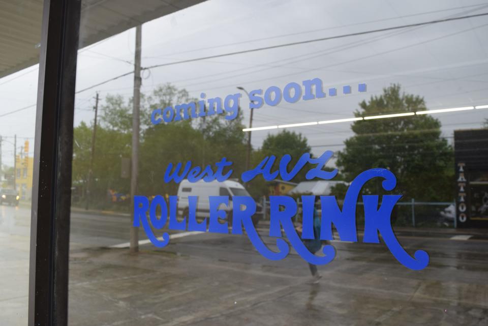 A sticker saying "West Asheville Roller Rink" was posted on the front of the old Family Dollar at 609 Haywood Road in West Asheville in early April. April 30, 2024.