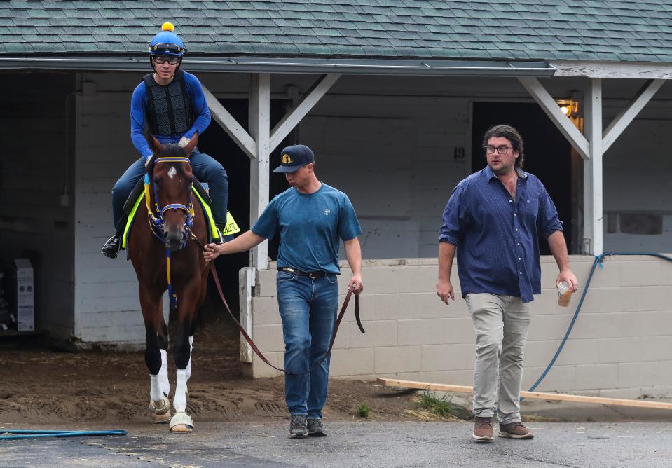 Trainer Saffie Joseph Jr. walks with Kentucky Derby contender Catalytic. The Barbados native says the deaths of two of his horses last year at Churchill Downs still affect him.