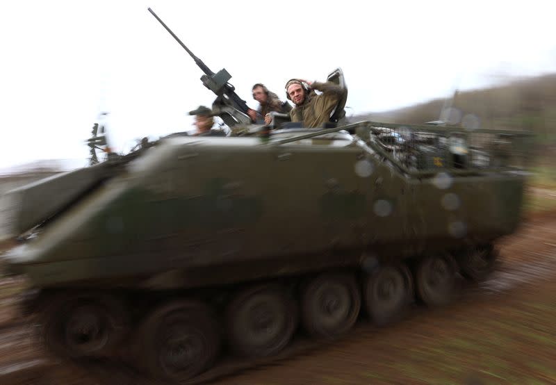 Ukrainian servicemen test their weapons on a training ground in Bakhmut region