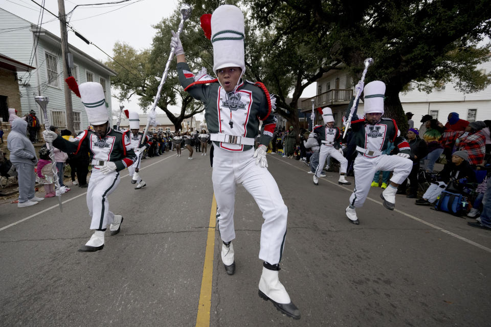 Drum majors from the Mississippi Valley State University marching band parade down Jackson Ave during the traditional Krewe of Zulu Parade on Mardi Gras Day in New Orleans, Tuesday, Feb. 13, 2024. (AP Photo/Matthew Hinton)