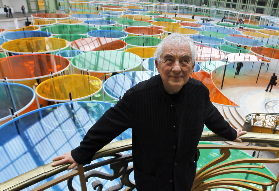 Contemporary artist Daniel Buren poses in the Grand Palais during the opening of ground-breaking Monumenta exhibit in Paris, Wednesday May 9, 2012. Monumenta, the hugely-popular annual installation project that's in its fifth year, dares an artist of international statue to "move into" the nave of one of the French capital's most monumentus buildings, and own it. (AP Photo/Francois Mori)