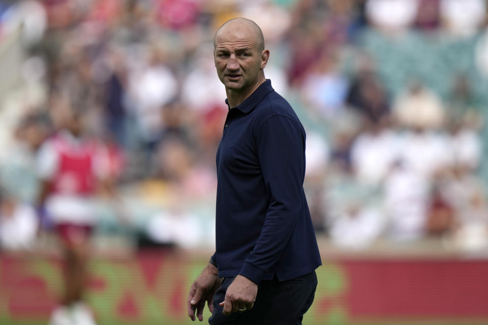 England's head coach Steve Borthwick watches on as players warm up for the rugby union international match between England and Fiji at Twickenham stadium in London, Saturday, Aug. 26, 2023. (AP Photo/Alastair Grant)