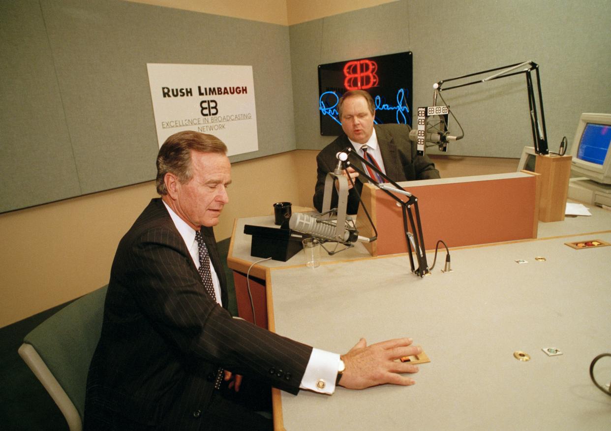 President George Bush talks with conservative radio host Rush Limbaugh at WABC studios in New York City, Sept. 1992. 