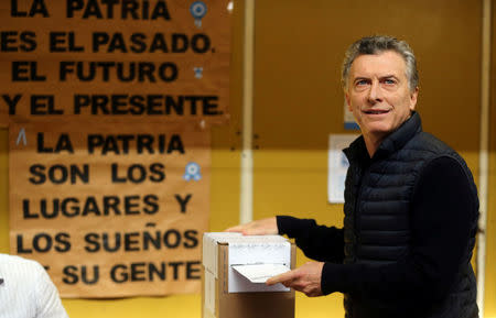 Argentine President Mauricio Macri casts his vote at a polling station in mid-term primary elections in Buenos Aires, Argentina August 13, 2017. REUTERS/Marcos Brindicci