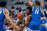 Texas A&M forward Solomon Washington attempts to get around Boise State guard Chibuzo Agbo (11) during the first half of an NCAA college basketball game in Fort Worth, Texas, Saturday, Dec. 3, 2022. (AP Photo/Emil Lippe)