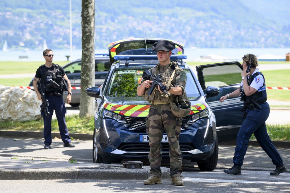 Police at the scene of the attack in the French alps (AP)