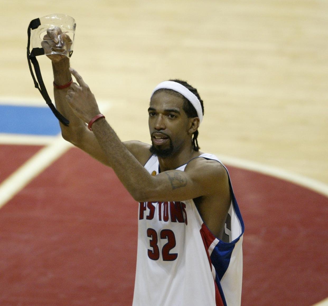 Detroit Pistons' Richard Hamilton points to his mask at the end of the 100-87 series-clinching victory over the Los Angeles Lakers in Game 5 of the NBA Finals, Tuesday, June 15, 2004 at the Palace of Auburn Hills.
