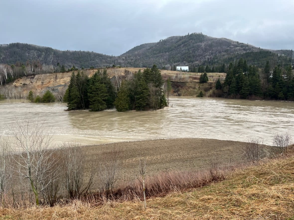 Flood waters inundated Claude Méthot's property on Monday, covering his fields with sand and clay. (Submitted by Claude Méthot - image credit)