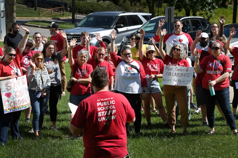 Asheville City Schools teachers held a rally before the school board meeting in Asheville, June 10, 2024.