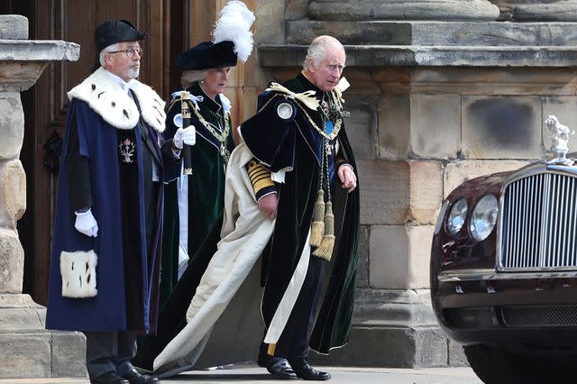 <p>Robert Perry - Pool/Getty Images</p> King Charles and Queen Camilla travel to the coronation celebration on July 5.