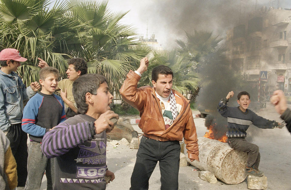 <p>A Palestinian activist with the PLO’s Fatah faction shouts slogans in the West Bank town of Ramallah as he urges others to avenge the killing of Palestinians shot to death by Israeli troops, Jan. 20, 1994. (Photo: Jacqueline Larma/AP) </p>