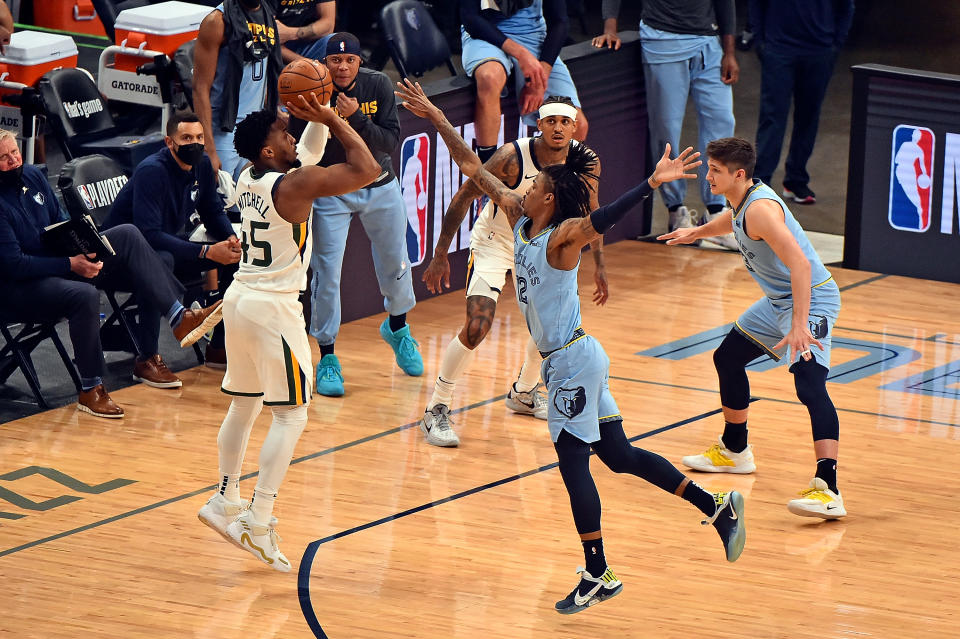 Donovan Mitchell of the Utah Jazz shoots against Ja Morant of the Memphis Grizzlies