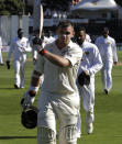 New Zealand's Tom Latham leaves the field at the close of the New Zealand innings at 264 not out during play on day three of the first cricket test between New Zealand and Sri Lanka in Wellington, New Zealand, Monday, Dec. 17, 2018. (AP Photo/Mark Baker)