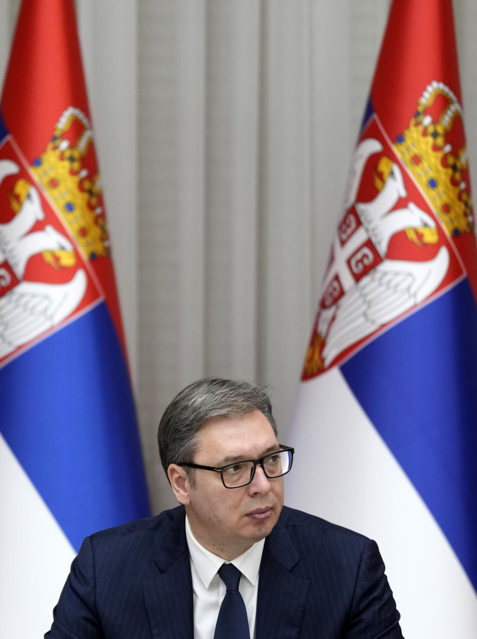 Serbian President Aleksandar Vucic attends the government session in Belgrade, Serbia, Thursday, Dec. 15, 2022. Serbia on Thursday formally demanded that its security forces return to the breakaway former province of Kosovo, despite warnings from the West that such calls are unlikely to be accepted and only add to tensions in that part of the Balkans. (AP Photo/Darko Vojinovic)