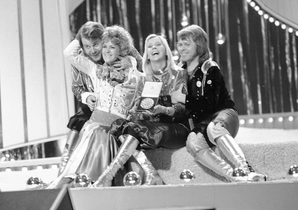 FILE - Swedish pop group ABBA celebrate winning the 1974 Eurovision Song Contest on stage at the Brighton Dome in England with their song Waterloo, April 6, 1974. The 68th Eurovision Song Contest is taking place in May in Malmö, Sweden. It will see acts from 37 countries vie for the continent’s pop crown. Founded in 1956, Eurovision is a feelgood extravaganza that strives to banish international strife and division. It’s known for songs that range from anthemic to extremely silly, often with elaborate costumes and spectacular staging. (AP Photo/Robert Dear, File)