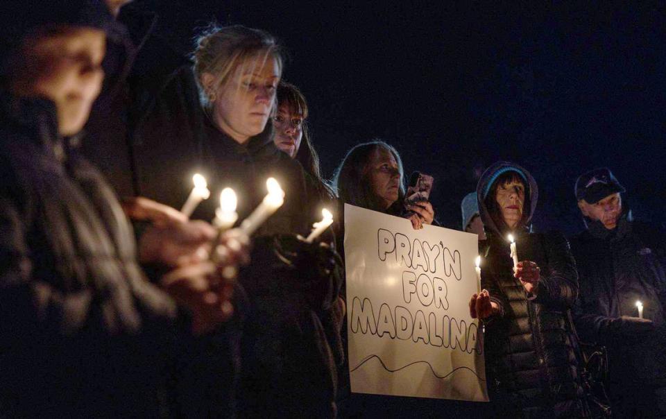 The community gathers for a candlelight vigil for Madalina Cojocari, 11, in Cornelius, N.C., on Tuesday, December 20, 2022.