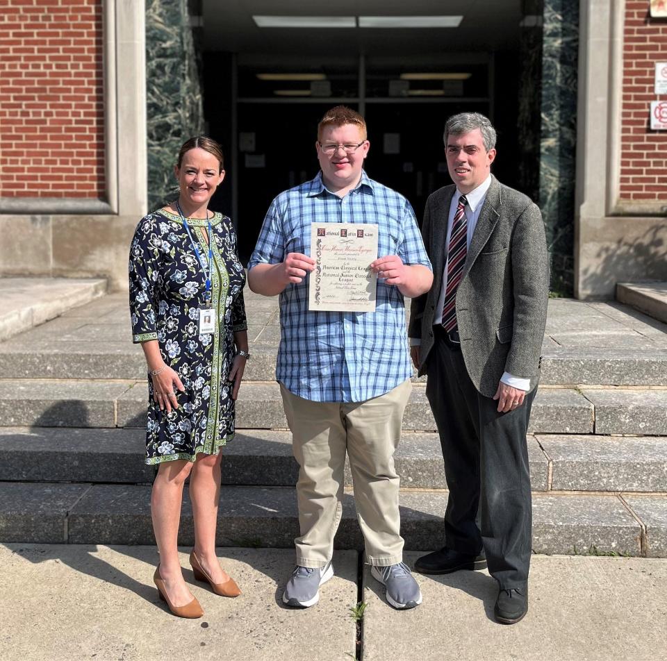 WHS senior Frank Wietry earned a perfect score on the Latin Level 2 exam.  The distinction of a perfect score was only attained by a very small number of students out of more than 100,000 who took the exam across the world. Wietry is pictured here with WHS principal Mary Asfendis (left) and Latin teacher James Rowan (right).