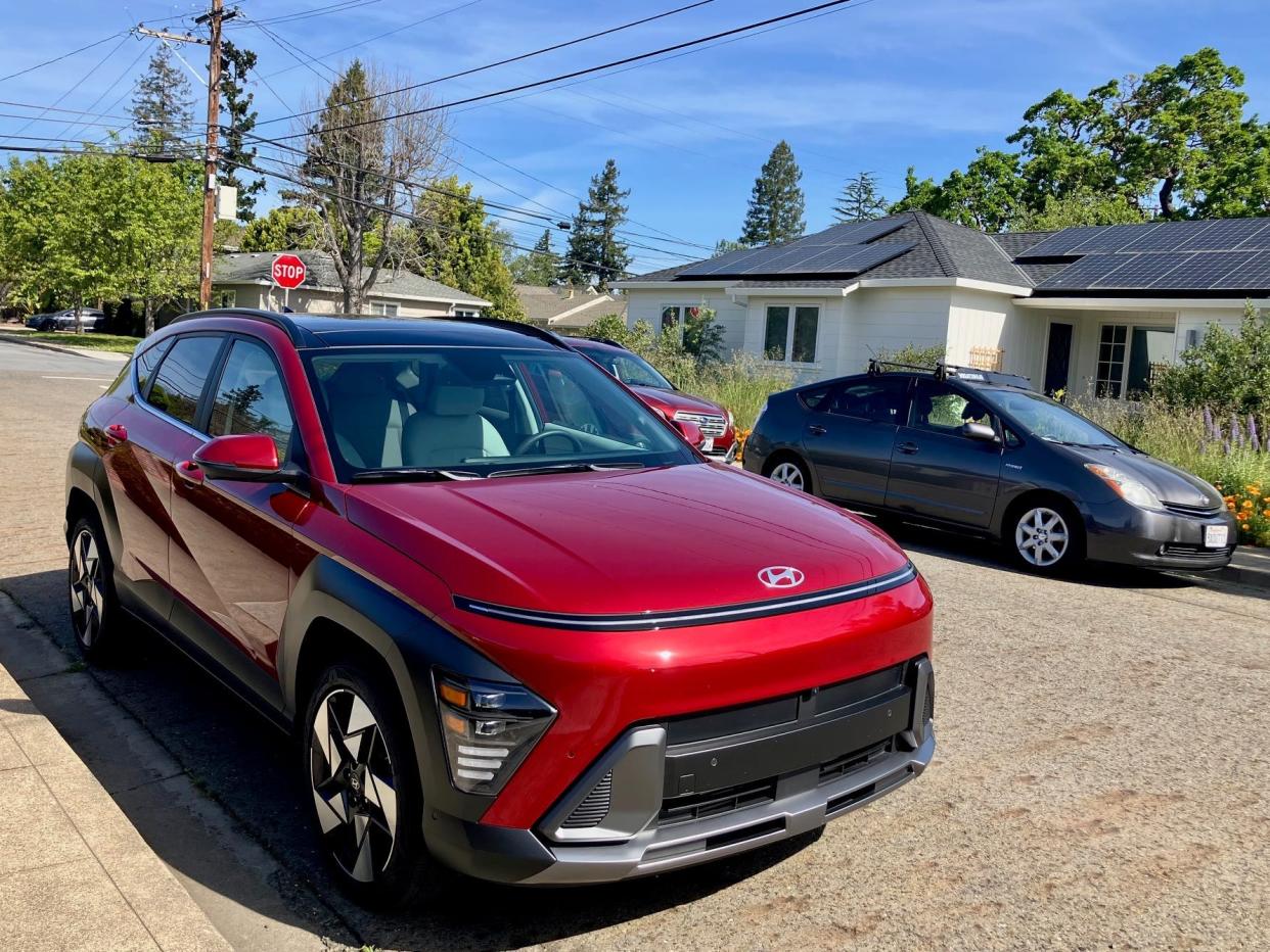 The 2024 Hyundai Kona Limited AWD parked in front of a suburban home