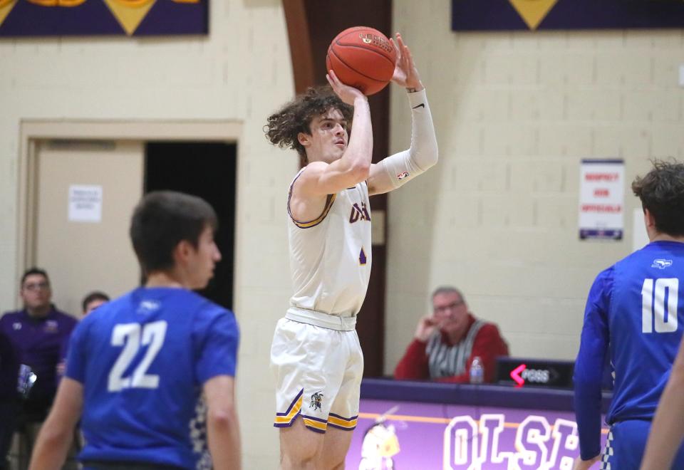 OLSH's Rocco Spadafora (1) shoots a three point shot after gaining distance from South Park's Jack Ozimek (10) during the first half Friday night at Our Lady of the Sacred Heart High School.