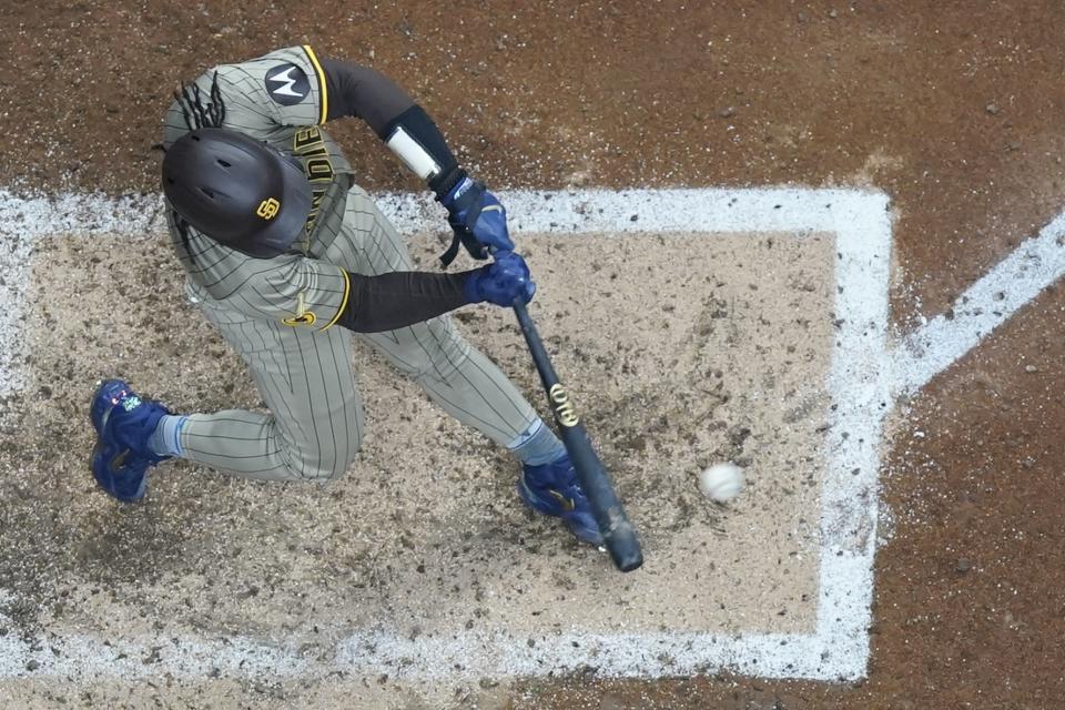 San Diego Padres' Luis Campusano hits an RBI single during the fifth inning of a baseball game against the Milwaukee Brewers Monday, April 15, 2024, in Milwaukee. (AP Photo/Morry Gash)