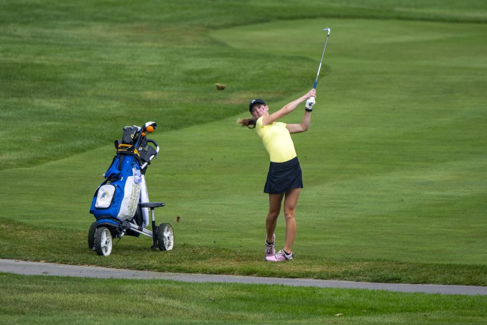 Castle High School junior Ashley Kirkland hits an approach shot on to the ninth green during the first day of the IHSAA Girlsâ€™ Golf State Finals, Friday, Sept. 29, 2023, at Prairie View Golf Club.