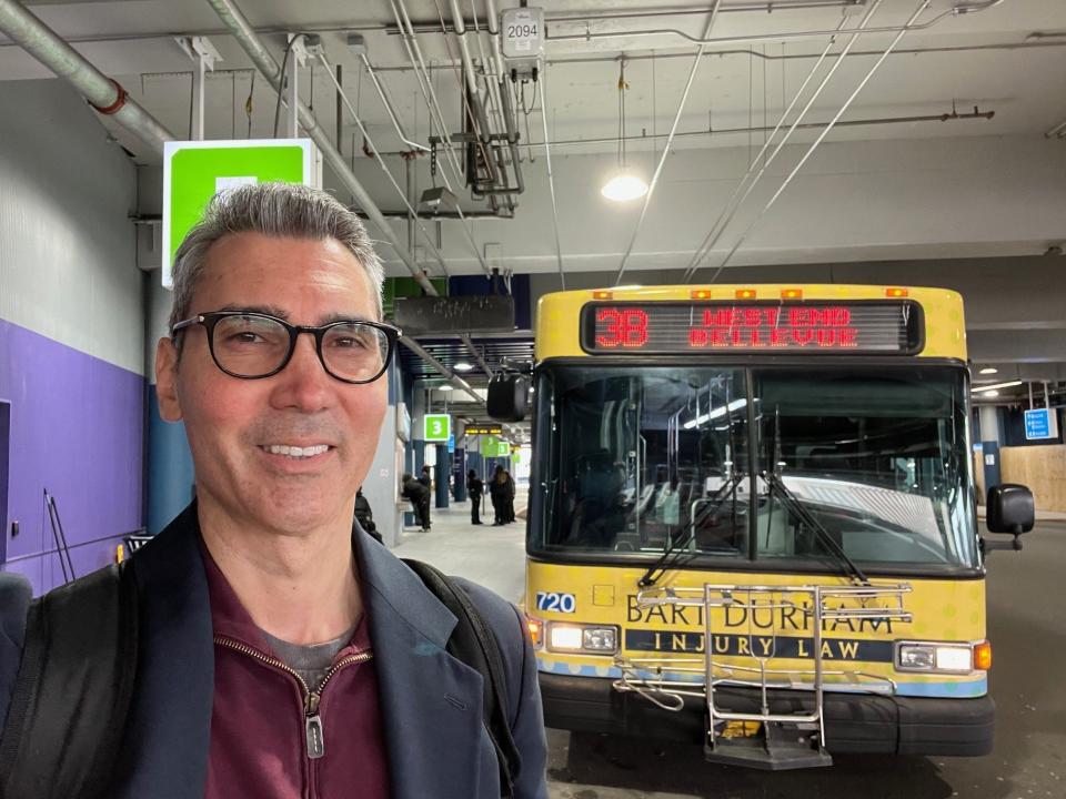 The Tennessean opinion columnist David Plazas in front of the No. 3 bus at the Elizabeth Duff Transit Center at WeGo Central bus station in downtown Nashville, Feb. 16, 2024. He took it to work at The Tennessean offices in Midtown.