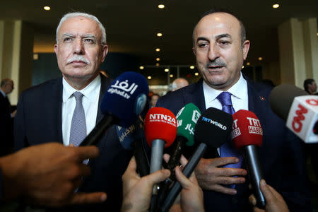 Turkish Foreign Minister Mevlut Cavusoglu (R) speaks to the press after the United Nations General Assembly emergency special session on U.S. President Donald Trump's decision to recognize Jerusalem as Israel's capital in Manhattan, New York, U.S., December 21, 2017. REUTERS/Amr Alfiky