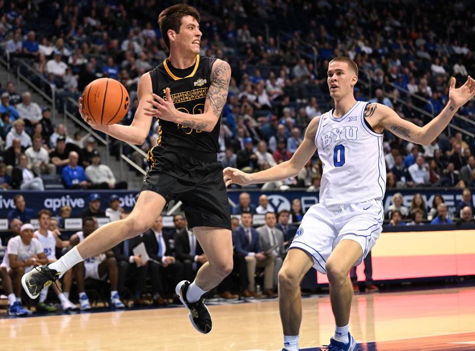 Southeastern Louisiana Lions guard Nick Caldwell (22) jumps out of bounds and looks for a pass with Brigham Young Cougars forward Noah Waterman (0) defending as BYU and SE Louisiana play at the Marriott Center in Provo on Wednesday, Nov. 15, 2023. | Scott G Winterton, Deseret News