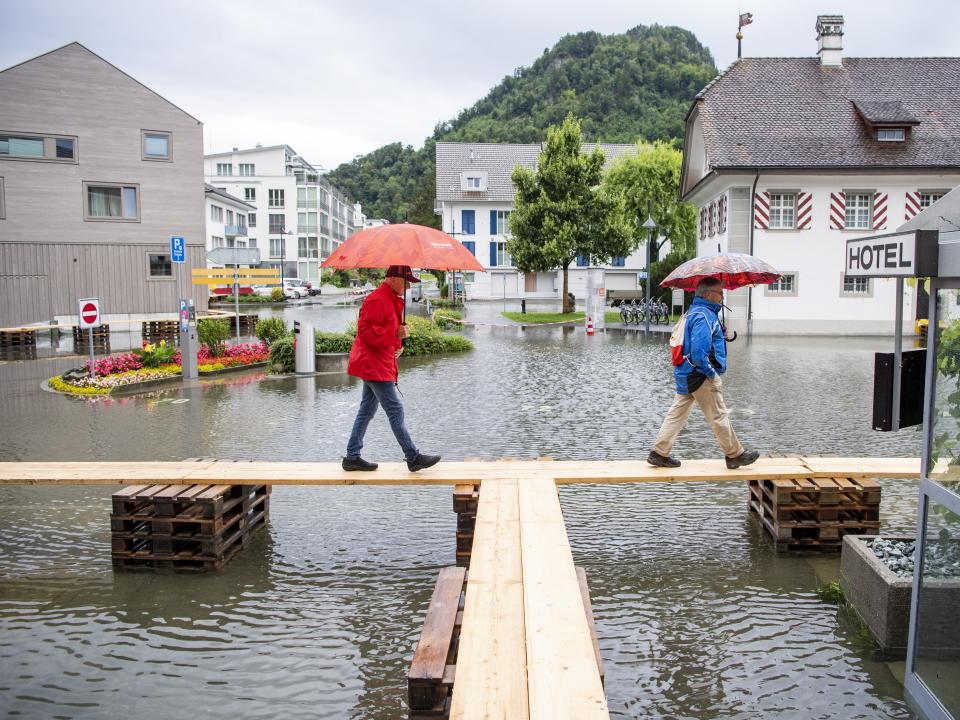 The village square of Stansstad in the canton of Nidwalden on Lake Vierwaldstaettersee is covered with flood water in Switzerland (Urs Flueeler/EPA)