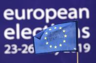 FILE PHOTO: People demonstrate outside EU Parliament during European Parliament Elections, in Brussels