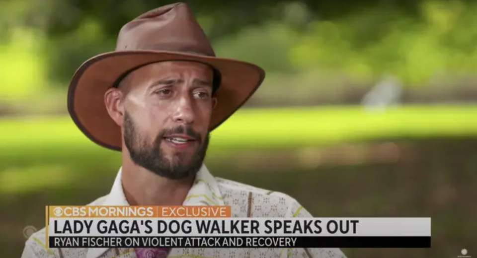 Still from an interview with Ryan Fischer with a chyron: Lady Gaga's Dog Walker Speaks Out