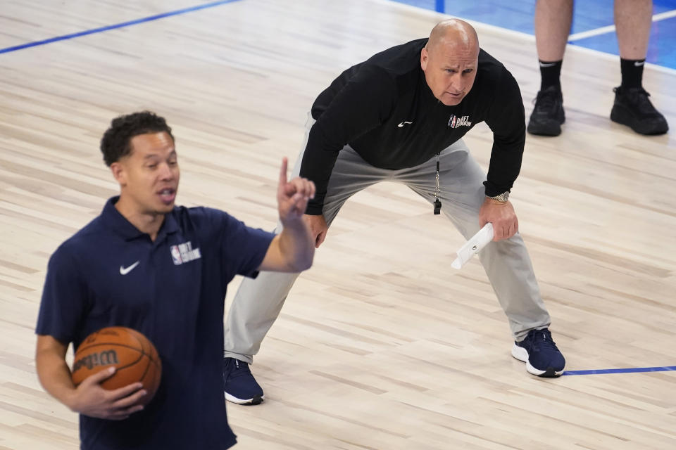 FILE - Jim Boylen, right, supervises the on-court drills during the NBA basketball draft combine May 18, 2022, in Chicago. Boylen led the coaching staff Thursday, Feb. 23, 2023, as the United States defeated Uruguay in a FIBA Americas game. The U.S. clinched a berth in the 32-team FIBA World Cup. (AP Photo/Charles Rex Arbogast, File)