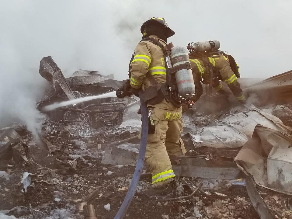 Chatham Emergency Services firefighters at the scene of a structure fire.