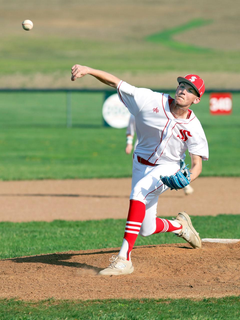 Brody White fires a pitch in the third inning of Sheridan's 9-1 win against visiting Philo on Tuesday. White tossed a four-hitter as Sheridan improved to 9-0 with the win.