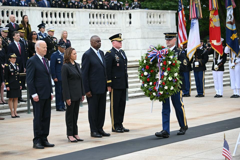 From left, President Joe Biden, Vice President Kamala Harris and Secretary of Defense Lloyd Austin participate in a wreath laying ceremony at the Tomb of the Unknown Soldier at Arlington National Cemetery on Monday in observance of Memorial Day in Arlington, Va.