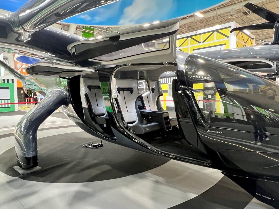 A view of the right side of the eVTOL with the door open looking inside the cabin.